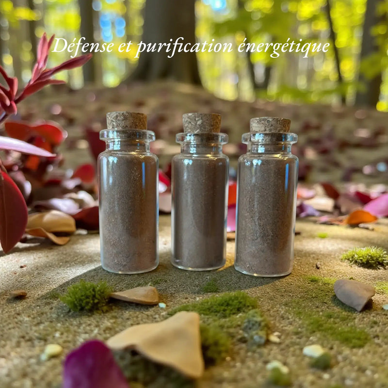 Image de trois flacons de poudre retour à l'envoyeur. On peut lire le message "Défense et purification énergétique"